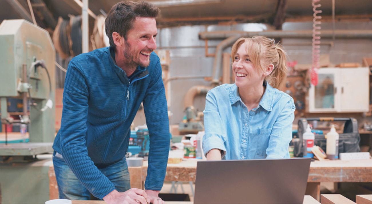 two-people-working-at-a-wood-workshop