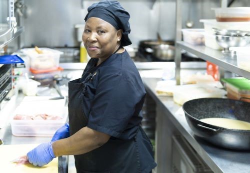 woman working as a chef in a restaurant
