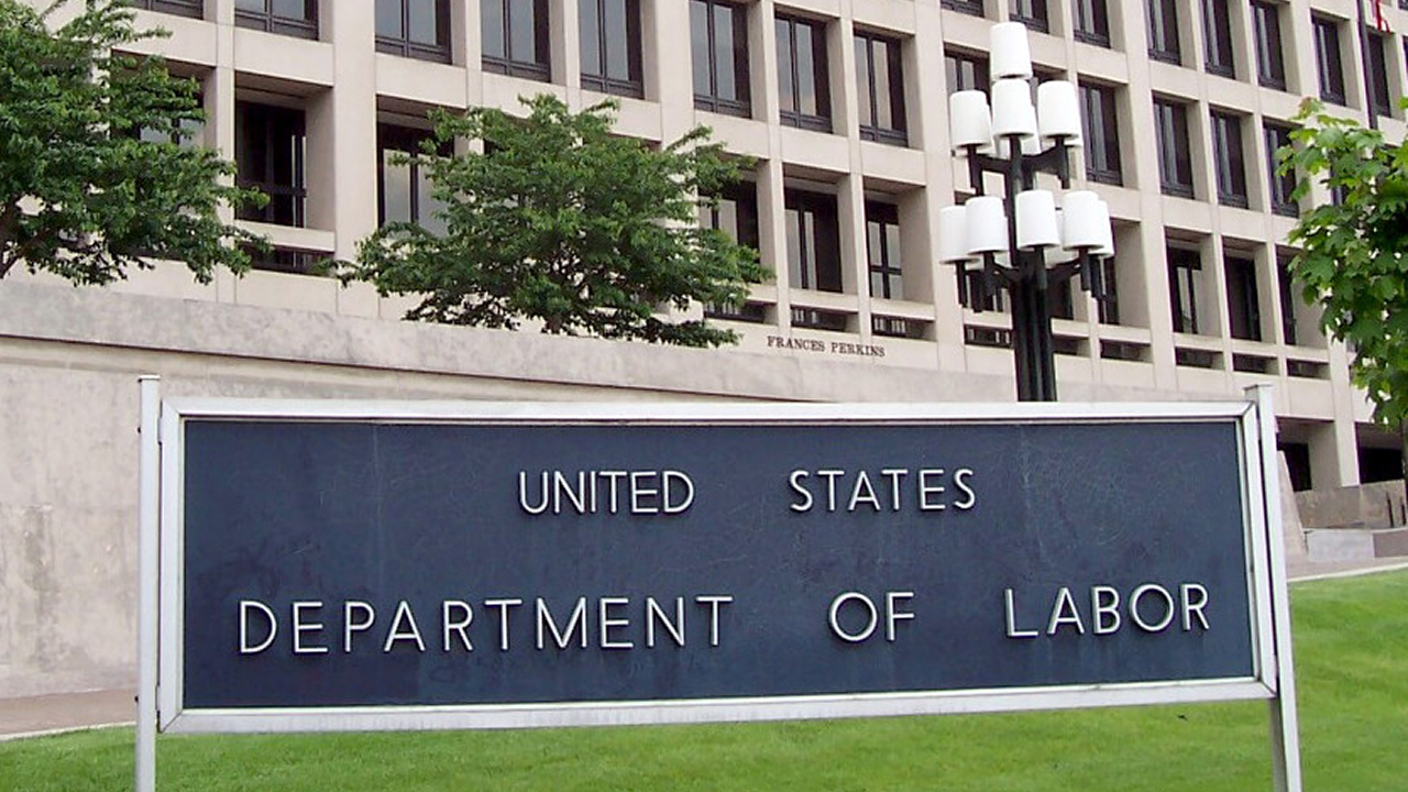 A close-up picture of the sign on the Frances Perkins Building