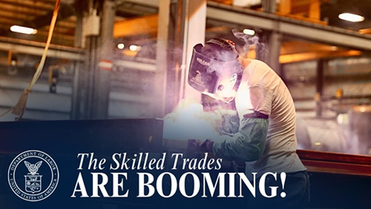 Person welding metal in a workshop with text saying ‘The Skilled Trades Are Booming.'