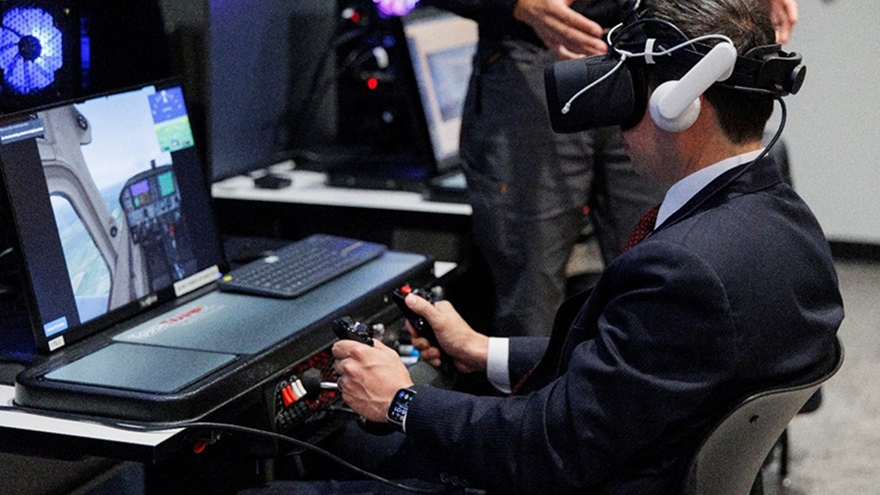 Person using a VR headset and flight simulator controls