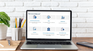 A laptop on a desk, open to reveal a Labor Department webpage featuring workplace benefits resources