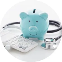 A piggy bank, calculator, and stethoscope 