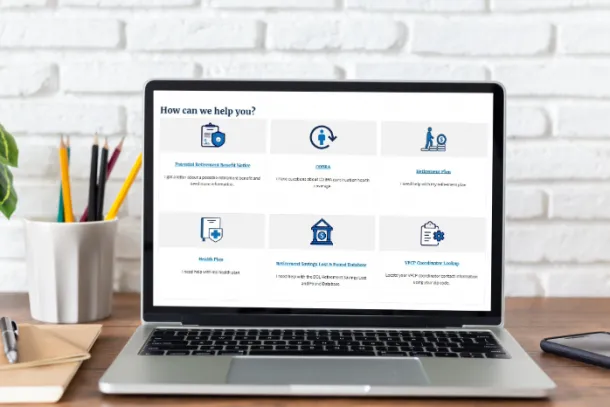 A laptop on a desk, open to reveal a Labor Department webpage featuring workplace benefits resources