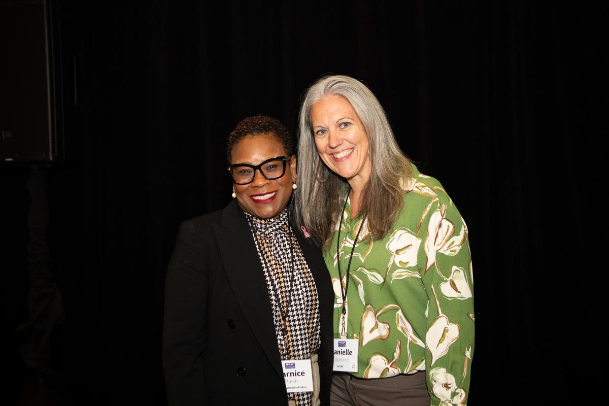 Two women stand side-by-side, smiling. Their nametags read "Darnice" and "Danielle."