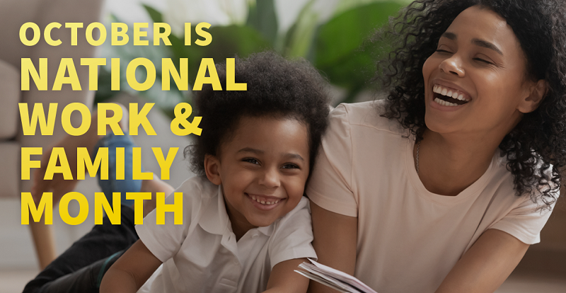 A dad returning home from work greets his two children with a hug