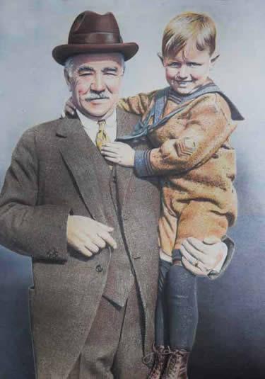Milton Hershey holding a child