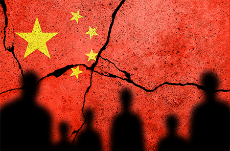 shodow of people on a cracked flag of china