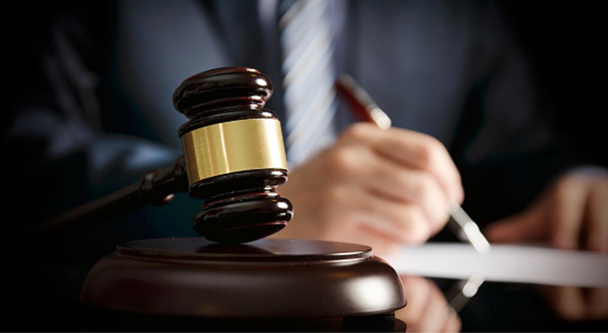 a wooden gavel on a desk