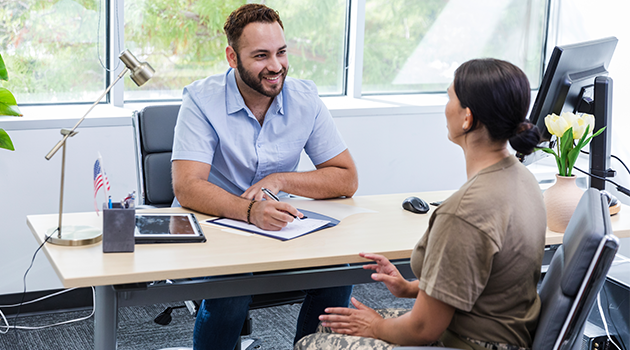 Man and woman sitting at an office desk