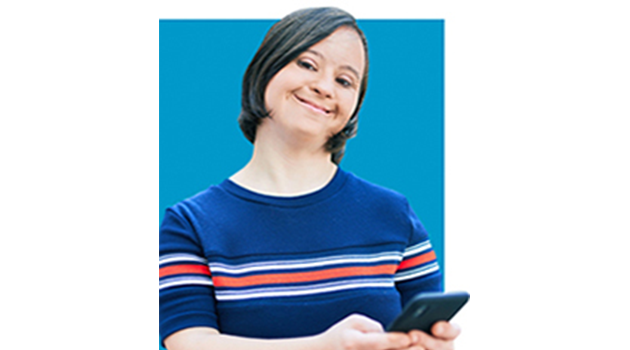 Woman in blue shirt holding a phone